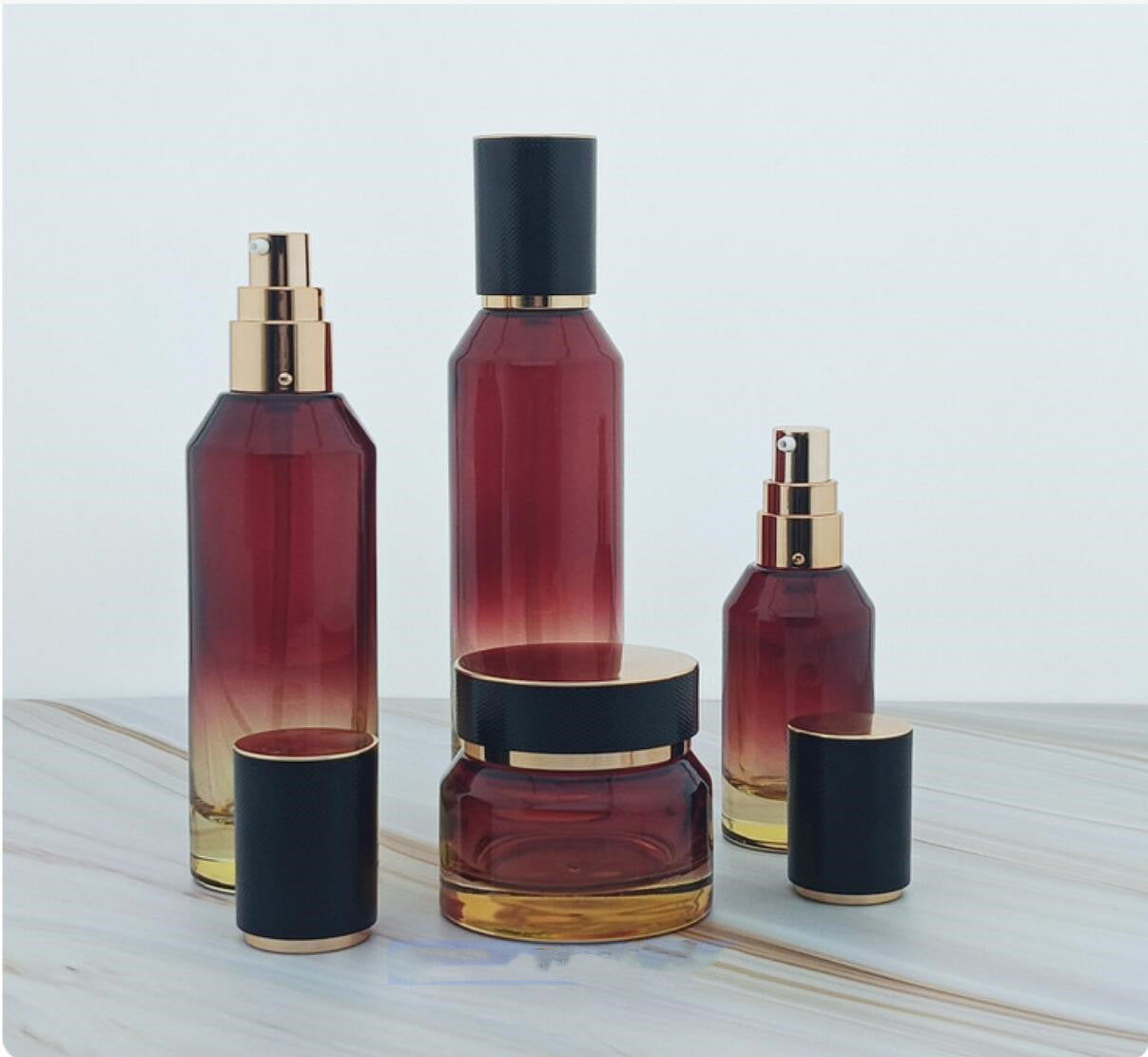 high quality luxury red colour cosmetic glass bottles slant cosmetic glass package with lid wholesale