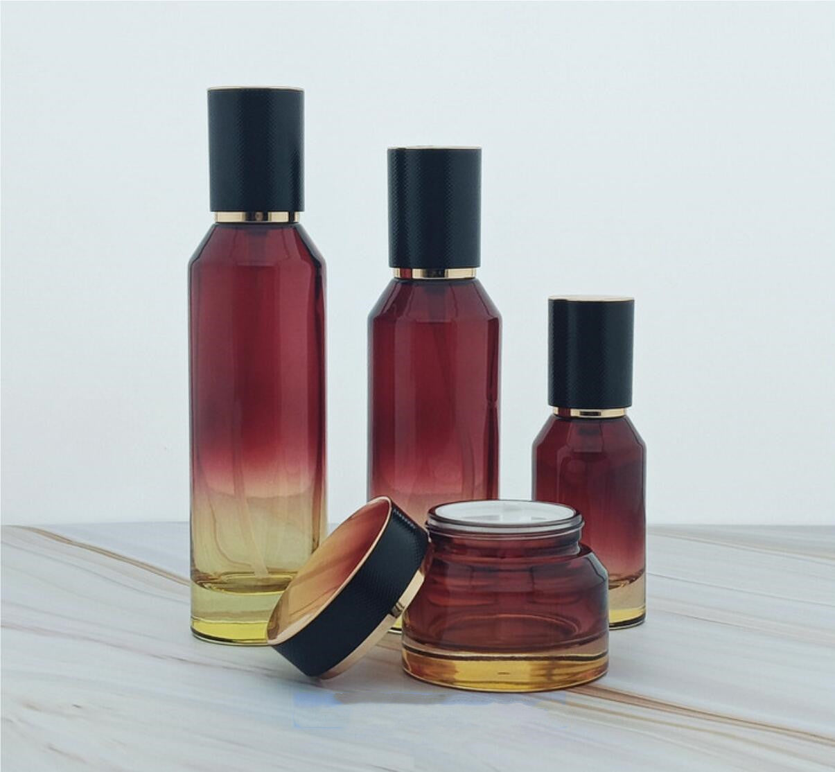 high quality luxury red colour cosmetic glass bottles slant cosmetic glass package with lid wholesale