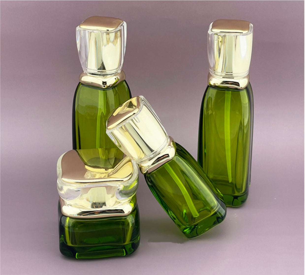 high quality luxury new style empty cosmetic green&nbsp; glass lotion bottles with press pump cosmetic bottles set skin care package&nbsp;