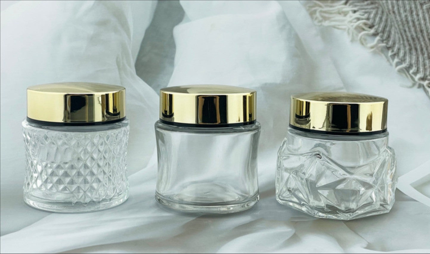 2025 new style fashion 100g empty clear cosmetic glass cream jar with gold lid wholesale