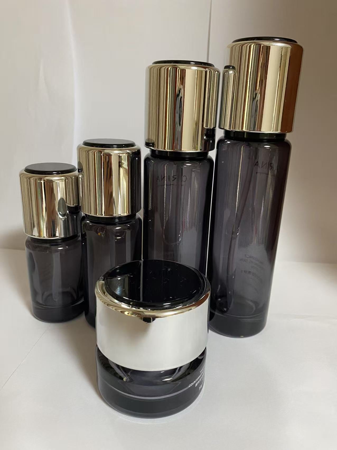 high quality empty black cosmetic glass lotion bottle cosmetic cream jar with lid wholesale