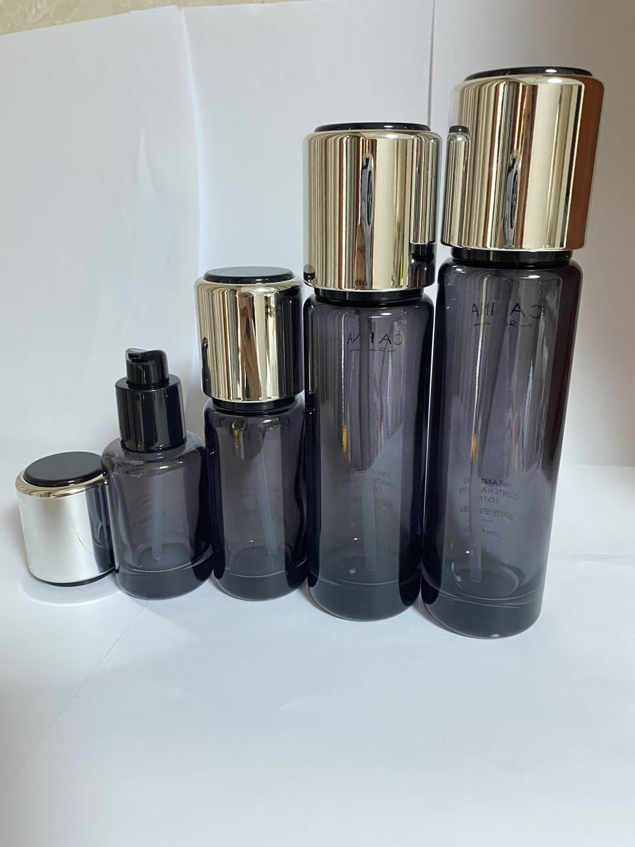 high quality empty black cosmetic glass lotion bottle cosmetic cream jar with lid wholesale