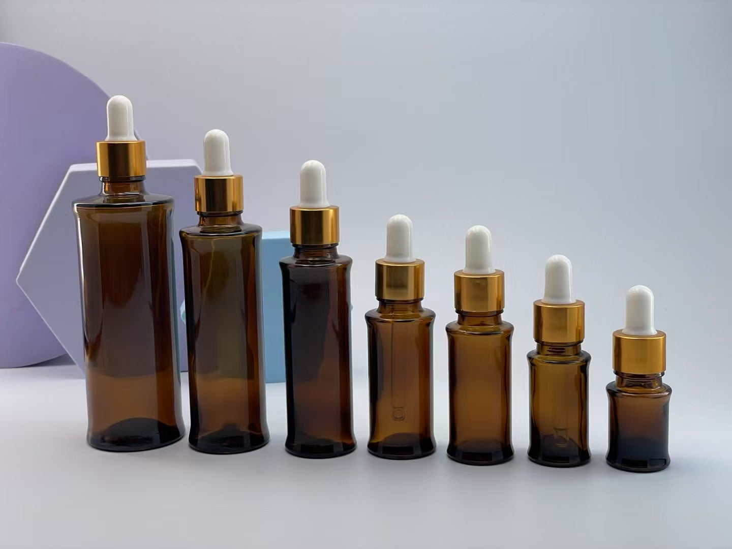 2025 high quality new style empty amber glass essential oil bottle with dropper/lid cosmetic glass package